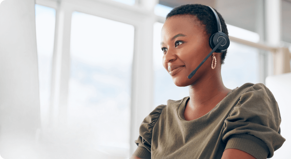 Female customer service advisor with a bluetooth headset on